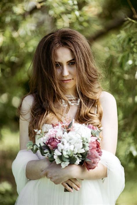 Brunette Bride In Fashion White Wedding Dress With Makeup Stock Photo