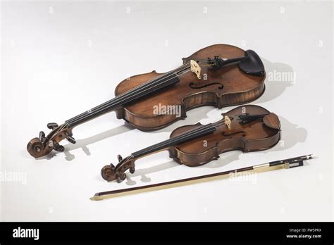 Violins, quarter size and full size, with 1/4- sized bow. German violin, late 19th Century ...