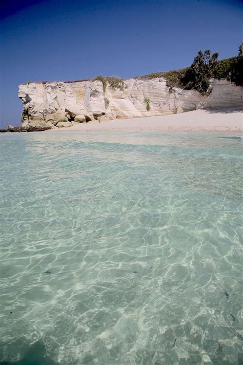 beaches in sumba - beautiful clear preserved ocean in sumba surf camp