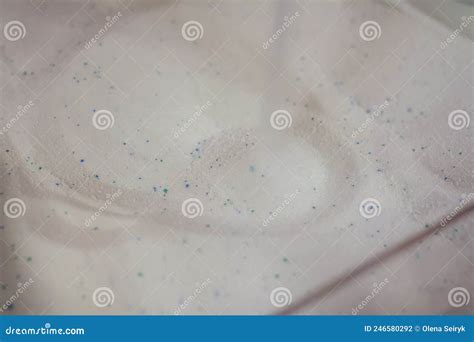 Soft Focused Shot Of Washing Powder Pile With Blue Granules Detergents