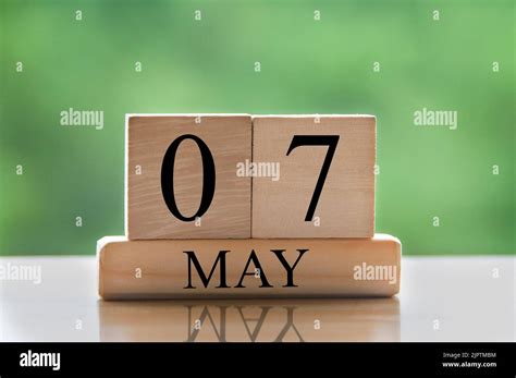 calendar date text  wooden blocks  blurred nature