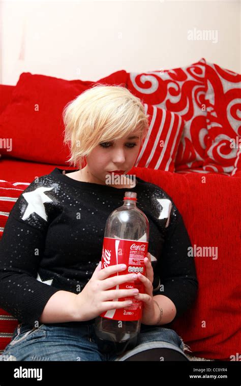 Teenage Girl Drinking From A Large Bottle Of Coca Cola Stock Photo Alamy