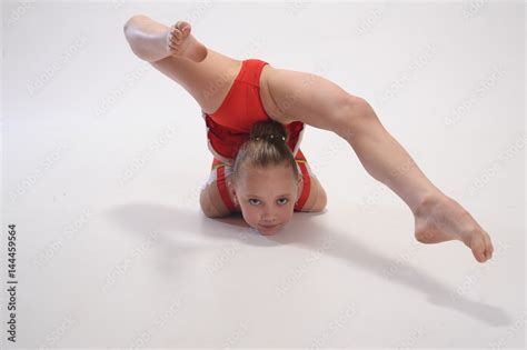 Young girl doing gymnastics Stock Photo | Adobe Stock