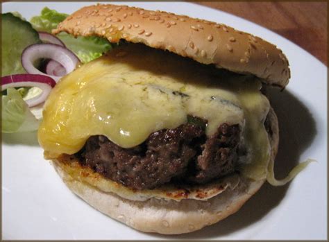 Spicy Burgers With Colston Bassett Stilton Cheese Melt A Glug Of Oil