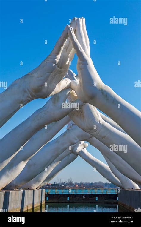 Building Bridges Sculpture By Artist Lorenzo Quinn Depicting 6 Pairs Of