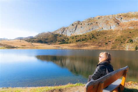 Relaxed Woman Sitting In Sunny Field Stock Photo Image Of Healthy