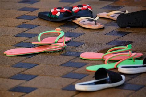 Several Pairs Of Flip Flops Next To Open Pool In Winter Stock Image