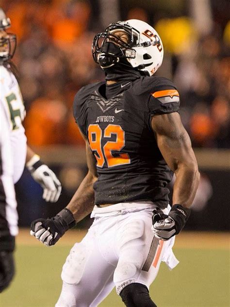 A Football Player Is Running On The Field