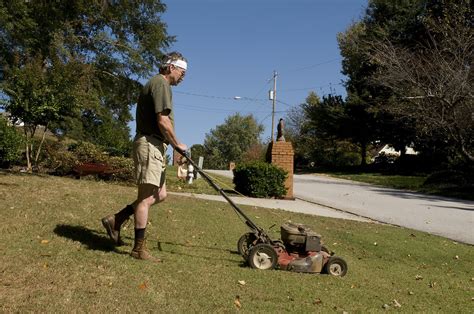 Mowing Grass Free Stock Photo A Man Mowing A Lawn 15237