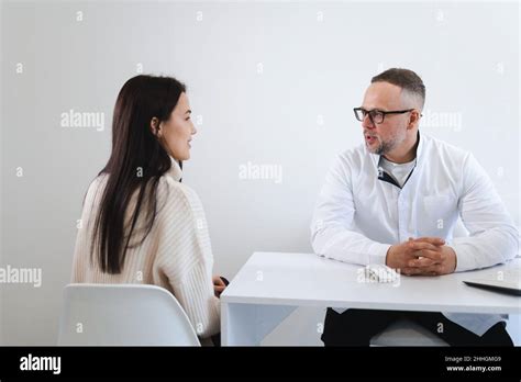 Young Woman At The Doctors Appointment Doctor Giving Advices To