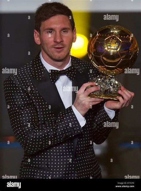 Lionel Messi of Argentina holds the trophy alloft after winning the ...