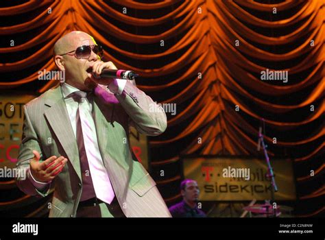 Grammy winner Pitbull performing at the 50th GRAMMY Celebration Concert ...