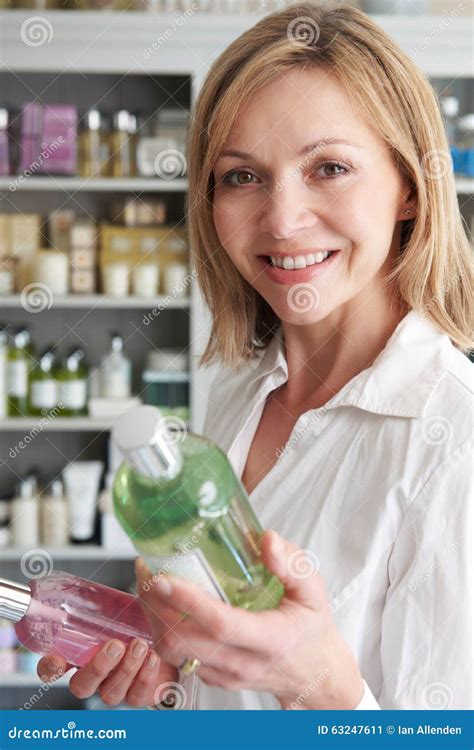 Female Customer In Shop Choosing Beauty Products Stock Image Image Of