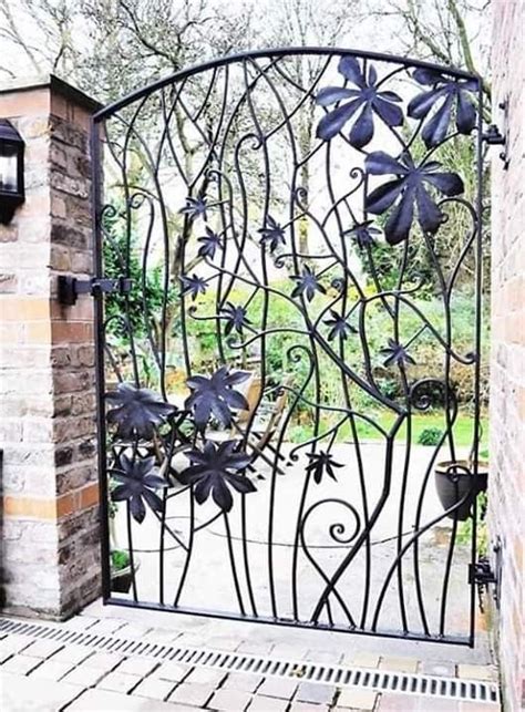 An Iron Gate With Flowers On It