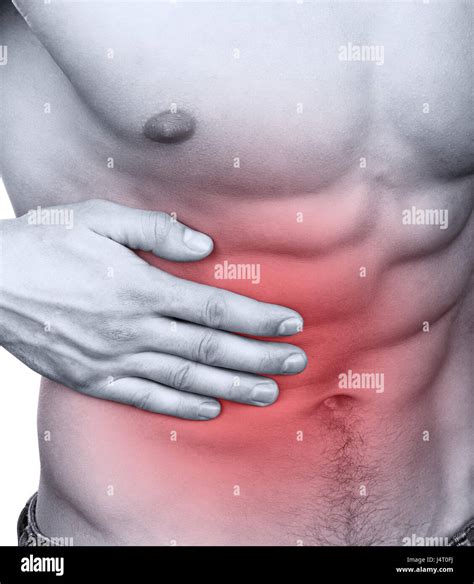 Muscular Man With Stomach Pain Isolated On White Background Stock Photo