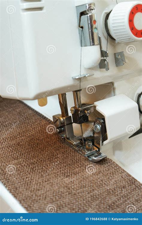 Overlock Sewing Machine In Process Professional Equipment Stock Photo