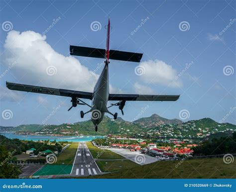 Plane Landing at Remy De Haenen Airport Also Known As Saint Barthelemy ...