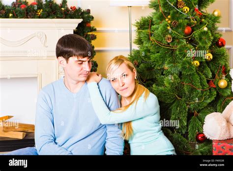 Love Couple Sitting On Carpet In Front Of Fireplace Woman And Man