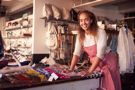 Female Sales Assistant In Bridalwear Store Stock Photo Image Of