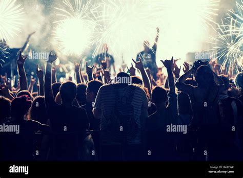 Cheering crowd at concert Stock Photo - Alamy