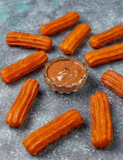 Free Photo | Traditional Mexican dessert churros with chocolate,top view