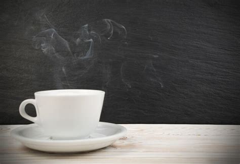 Premium Photo | White cup of coffee and steam