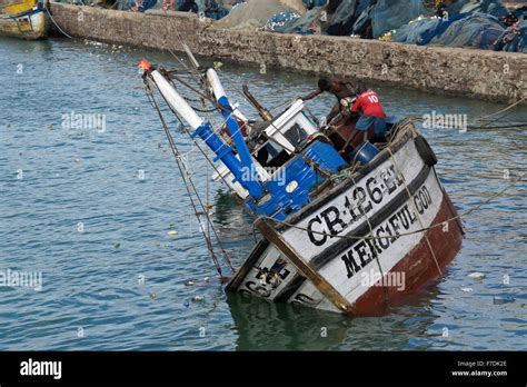 Fishing boat sinking in harbor, Cape Coast, Ghana Stock Photo: 90654774 - Alamy