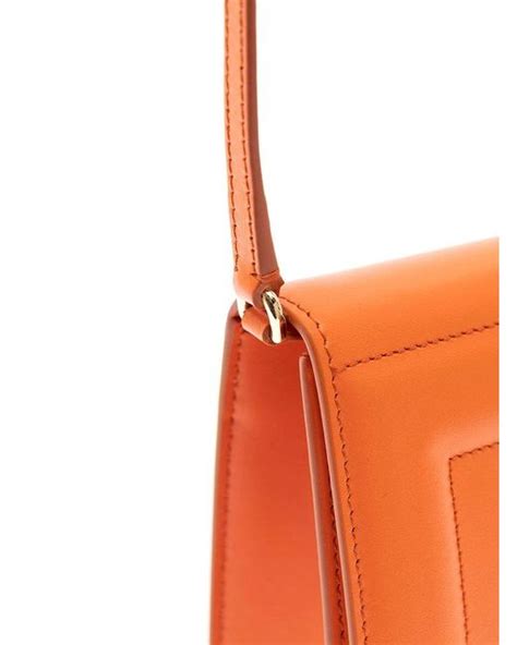 Dolce Gabbana Logo Embossed Foldover Top Crossbody Bag In Orange Lyst