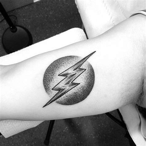 Lightning bolt tattoo on the arm Dot-work style tattoo of a lightning ...