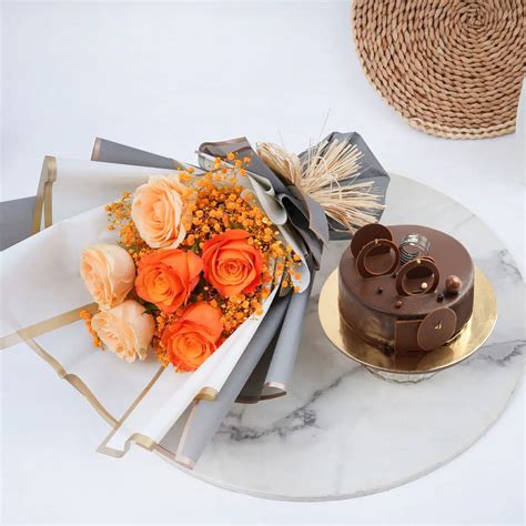 Online Chocolate Fudge Cake And Roses Bundle Gift Delivery In UAE FNP