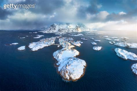 Aerial View Of Snowy Henningsvaer Fishing Village Lofoten Islands