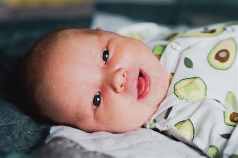 Premium Photo A Newborn Baby Is Resting In A Crib