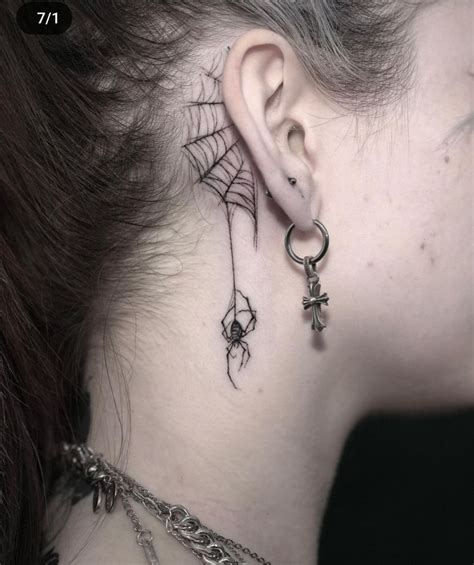 A Womans Neck With Spider Web And Cross Tattoo On Her Left Side Behind