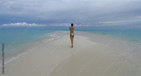 Beautiful Girl In A Bikini On The Seashore On The Island Stock Photo Adobe Stock