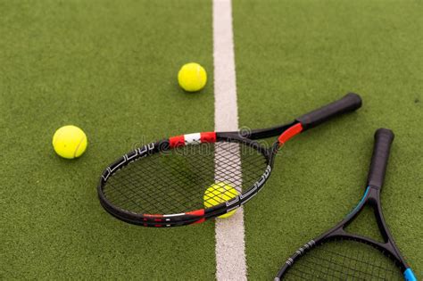 Tennis Racket with Balls on Green Background. Stock Photo - Image of ...