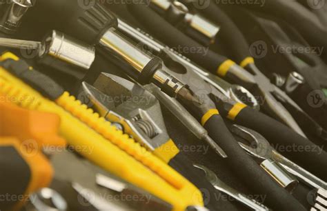 Handyman Tool Kit On Black Wooden Table Many Wrenches And Screwdrivers