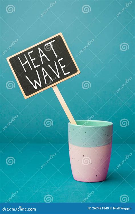 Hand Writing Sign Heat Wave Word Written On A Prolonged Period Of