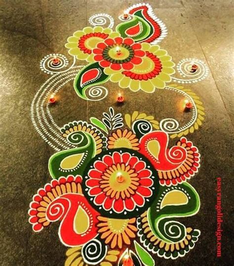 an intricately decorated floor with flowers and paisleys painted on the ground for diwaling