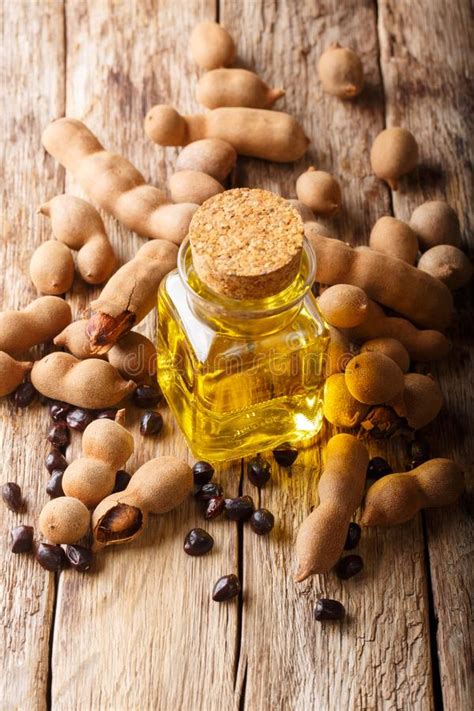 Aceite De La Vitamina De Hoyos Del Tamarindo En Un Primer De Cristal