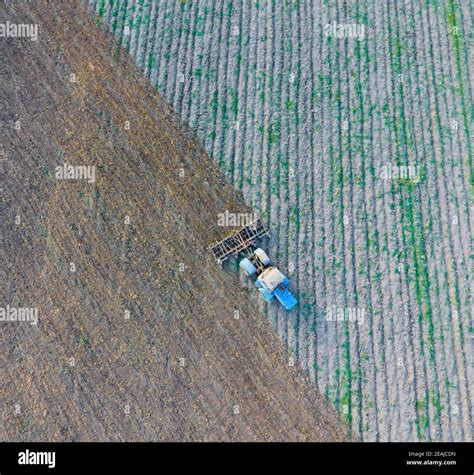 Top View Of The Tractor That Plows The Field Disking The Soil Soil