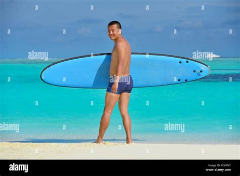 Man With Surf Board On Beach Stock Photo Alamy