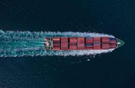 Aerial View Of Cargo Container Ship In The Sea At Night Stock Photo