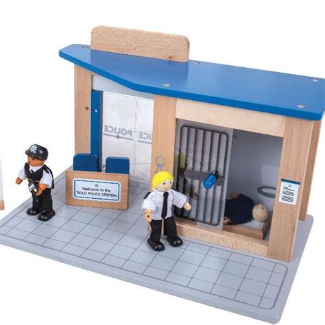 Two Toy Figurines Are Standing In Front Of A Police Station With The