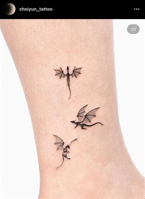 Two Small Dragon Tattoos On The Ankle One Is Black And One Is Grey