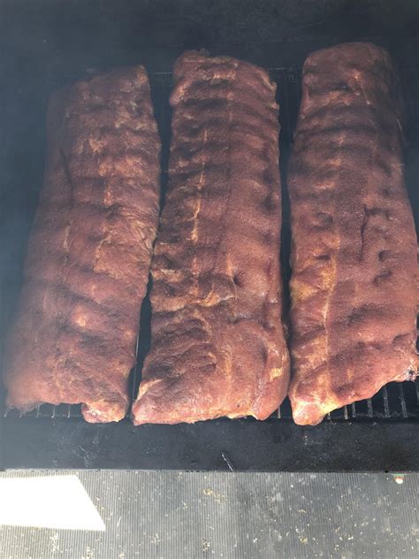 Teaching my boy how to use the pellet smoker : r/BBQ