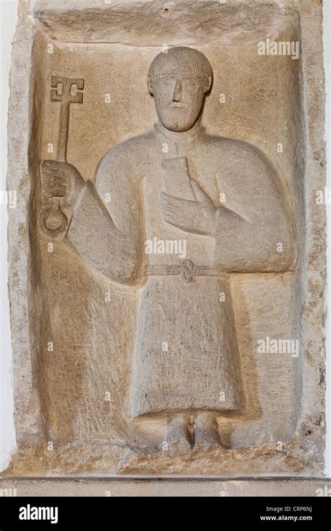 A Saxon sculpture in the Anglo-Saxon church of the Holy Rood in the Cotswold village of ...