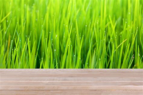 Premium Photo Brown Wood Table Top On Bokeh Abstract Green Nature