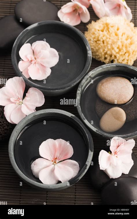 Spa Still Life With Pink Flowers Stones And Water Stock Photo Alamy