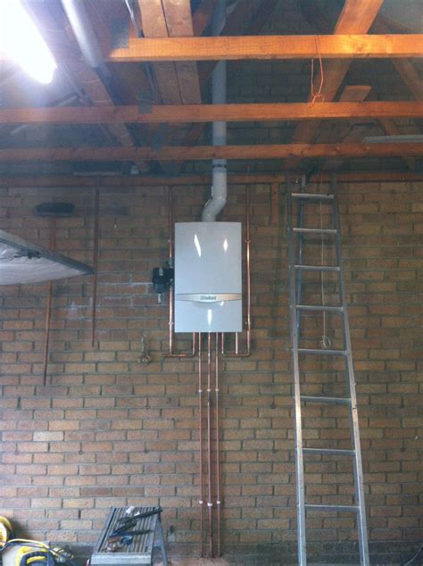 Vaillant Combi Boiler With A Vertical Flue Through The Roof With A