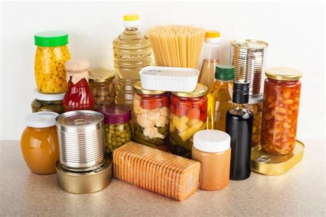 Premium Photo | Emergency survival food set on white kitchen table